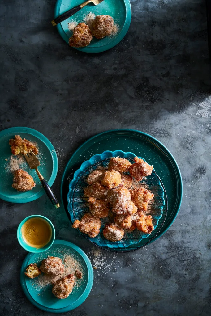 banana doughnuts in blue bowl piled up