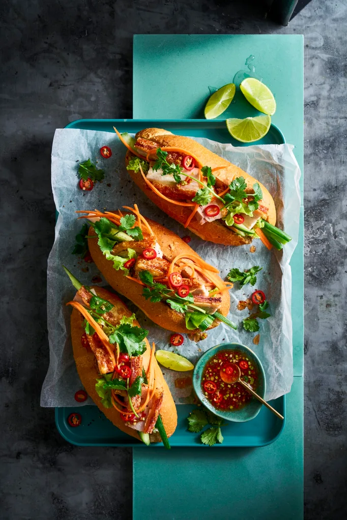 banh mi 3 rolls with pickled carrot pork belly and coriander on top