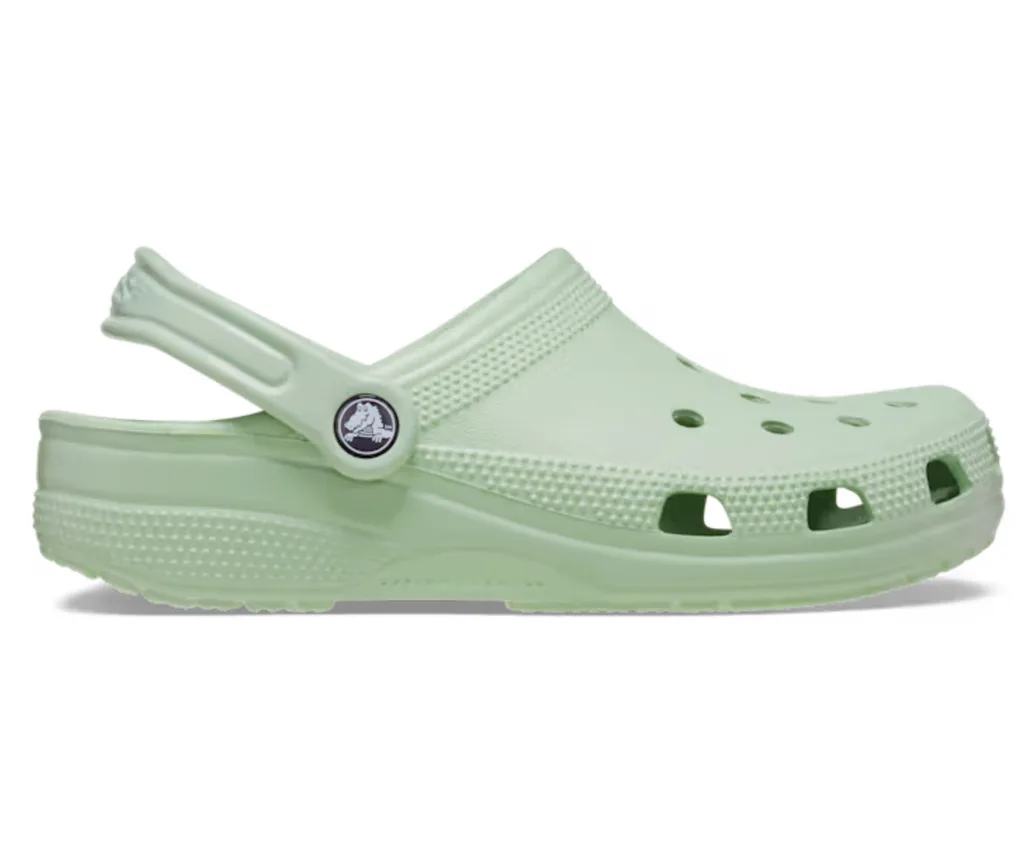 minty green crocs with heel strap slightly raised