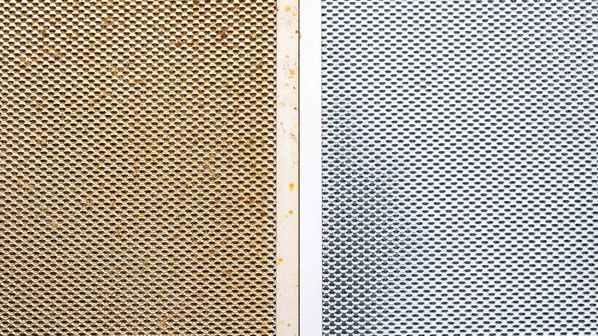 Before and after - dirty range hood filter and after, a clean range hood filter
