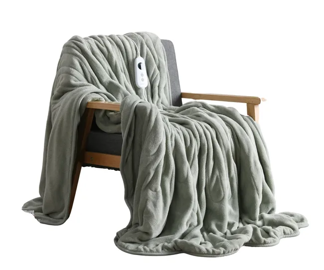 electric blanket in sage green colour hanging over chair