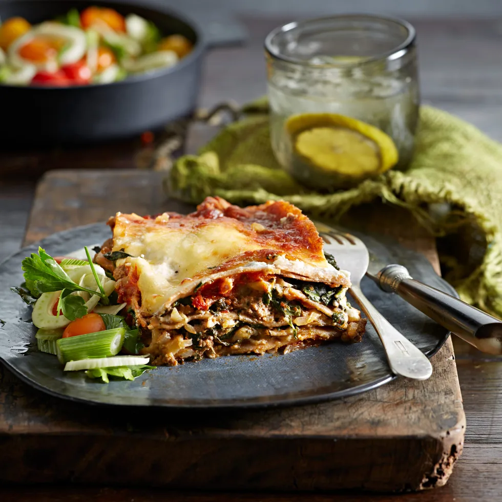 Slice of healthier lasagne with vegetables and cottage cheese