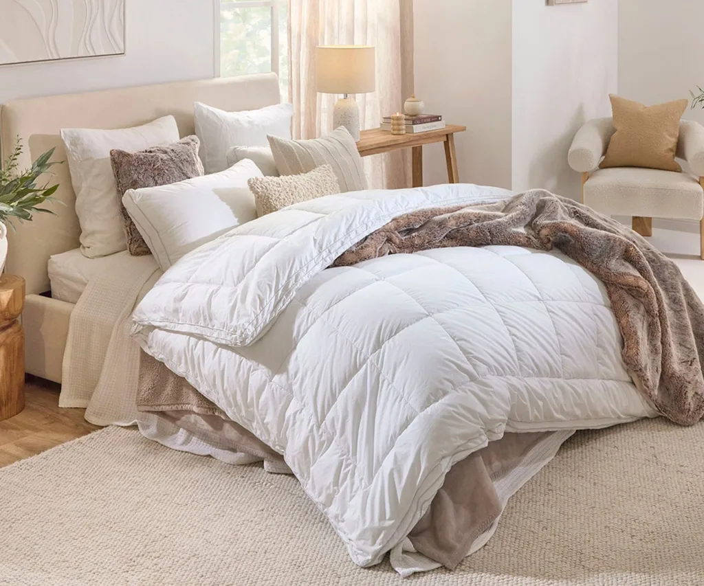 Hilton Hotel & Home Superior 500gsm Microfibre Quilt in white - on a double sized bed