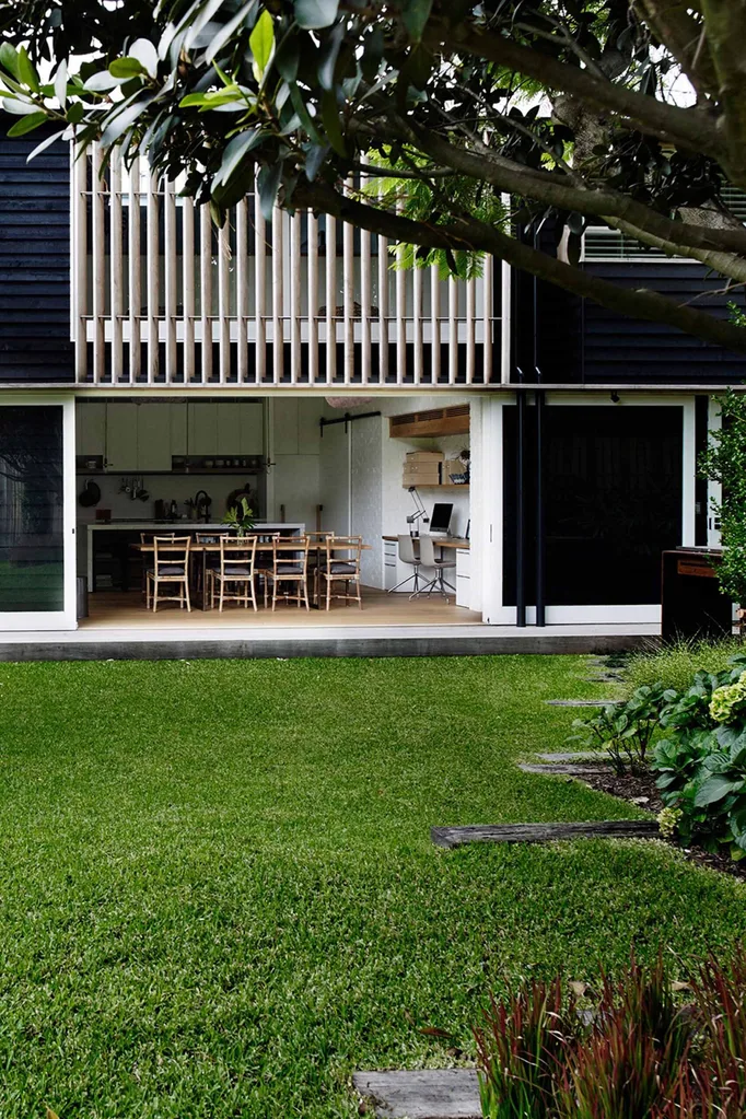 Backyard of modern home with lush buffalo grass lawn