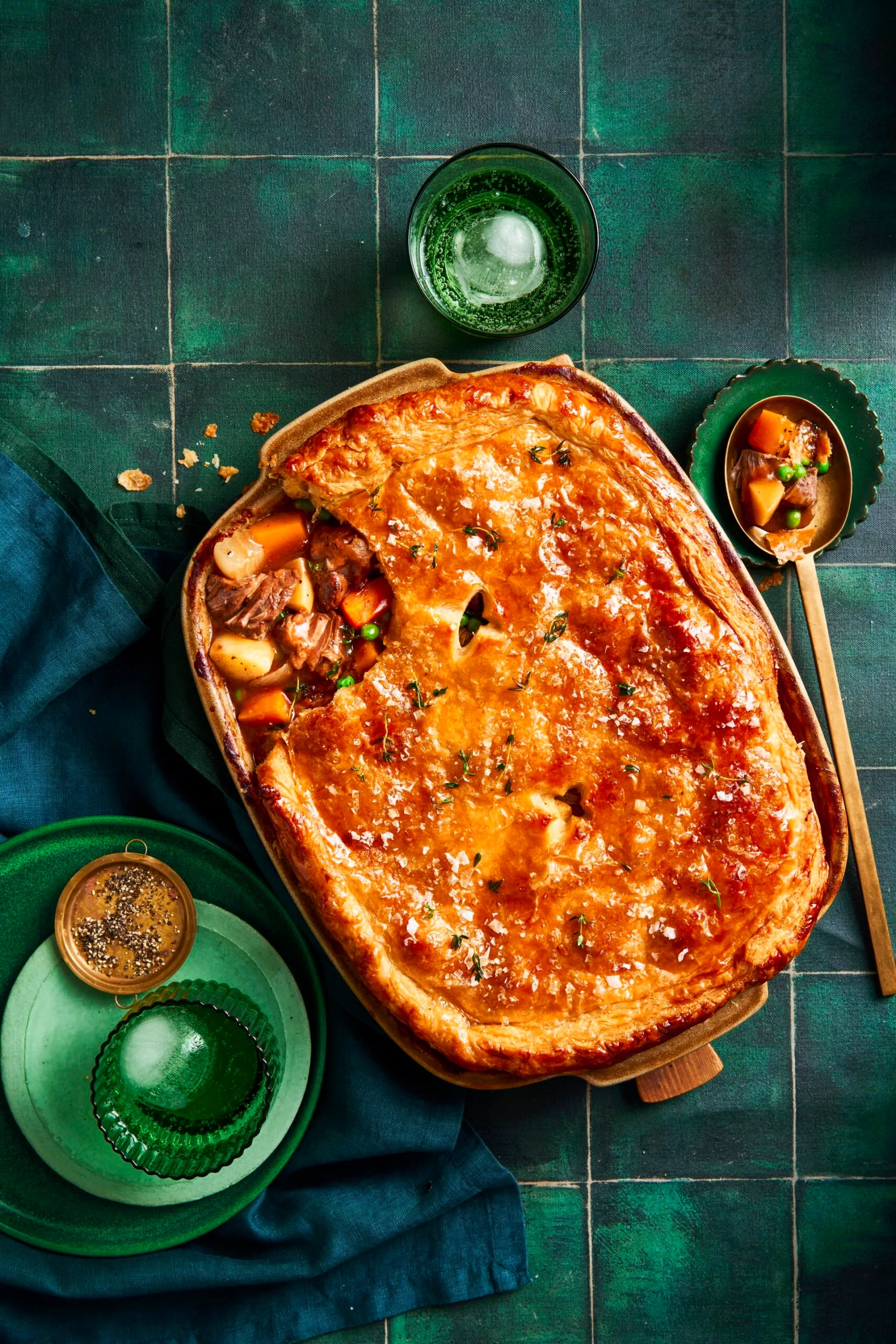 lamb pie with vegetables and one scoop taken out with spoon