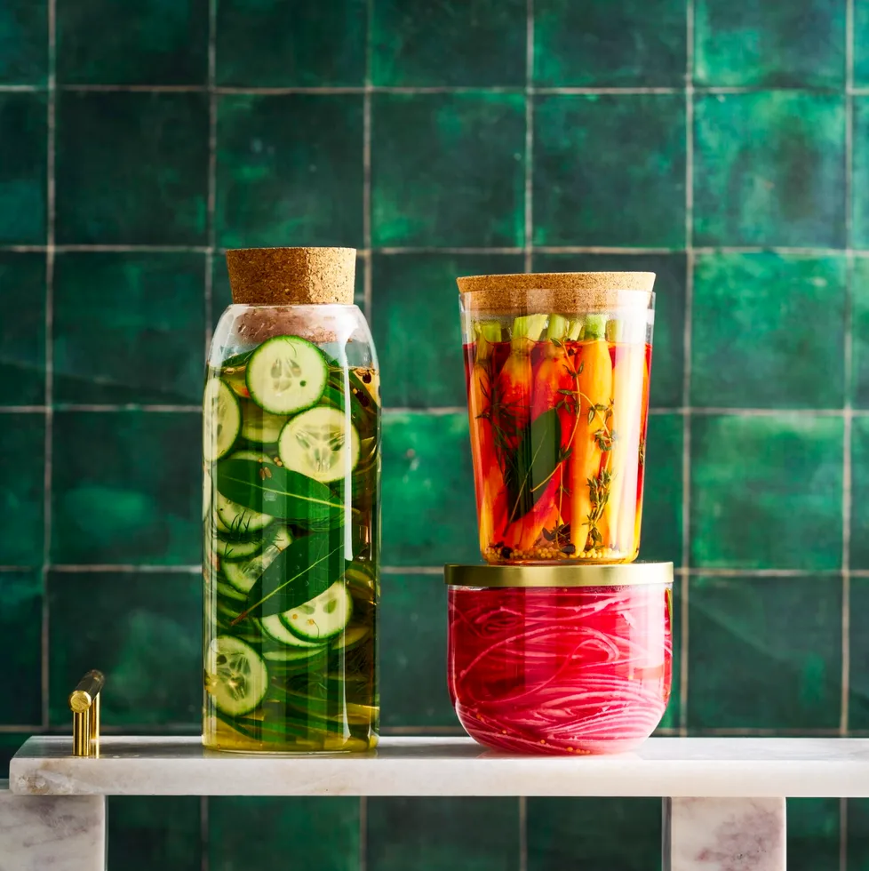 pickle recipe with cucumber pickles, carrot pickles and pickled onions in three separate jars