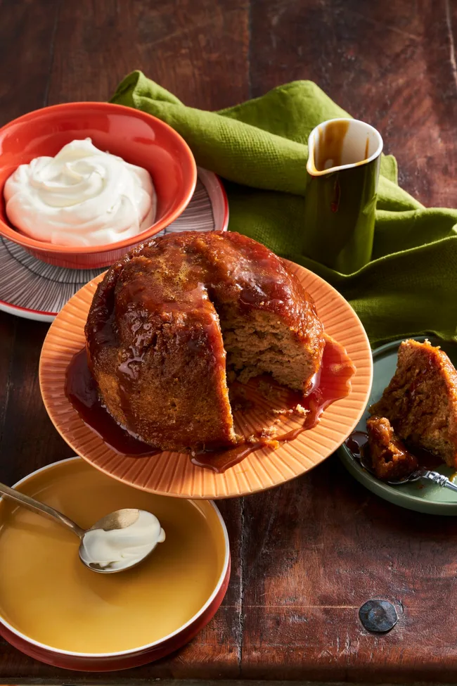 steamed pudding made in the microwave on orange plate