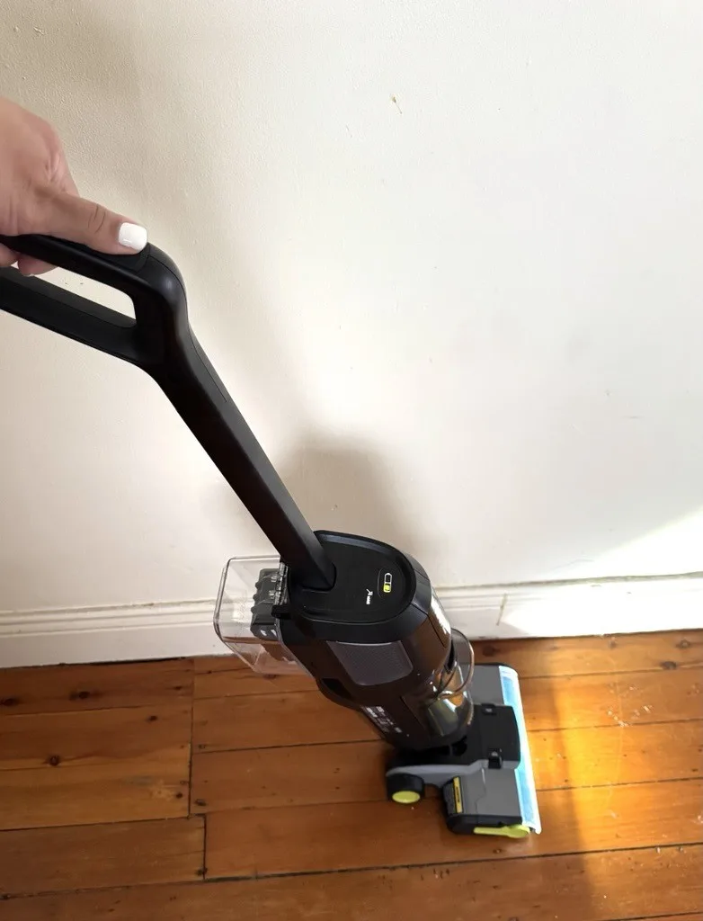 Ryobi floor cleaner in action, with its light