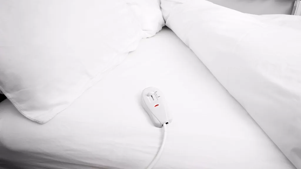 a white electric blanket ready to be washed
