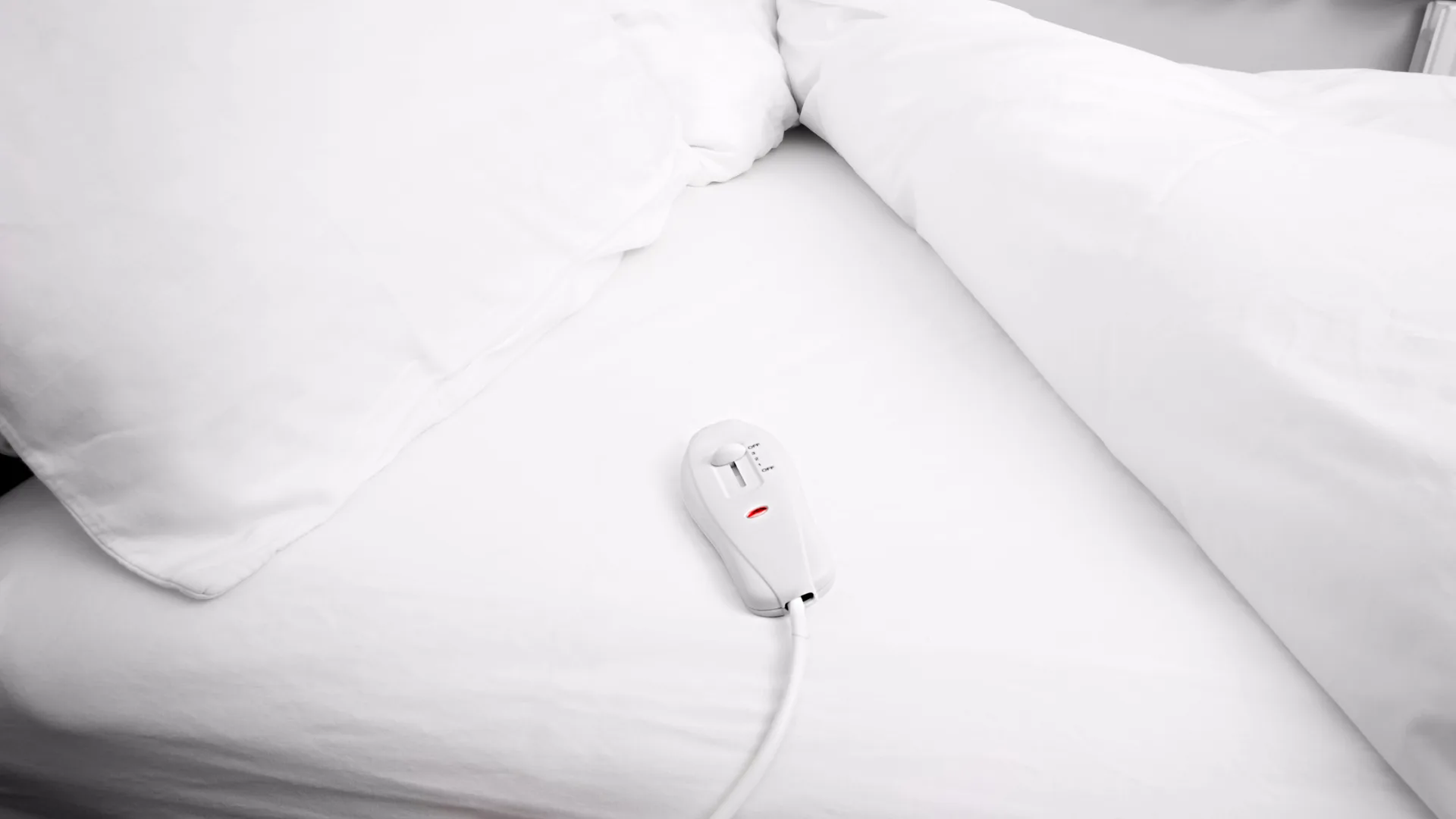 a white electric blanket ready to be washed