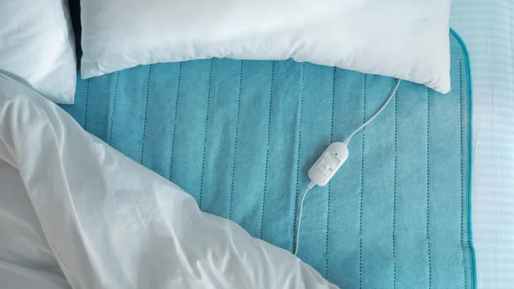 blue electric blanket on bed