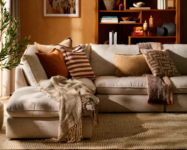 Cosy living room interior featuring warm orange shades