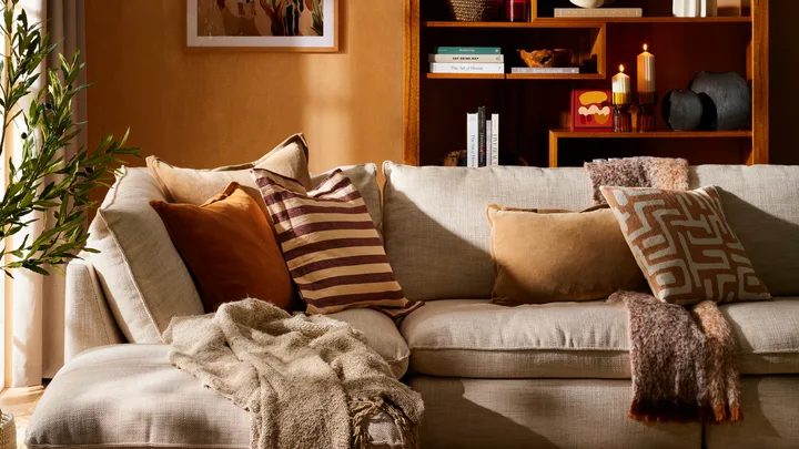 Cosy living room interior featuring warm orange shades