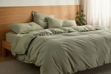 Bed with linens available using a Sheet Society discount code