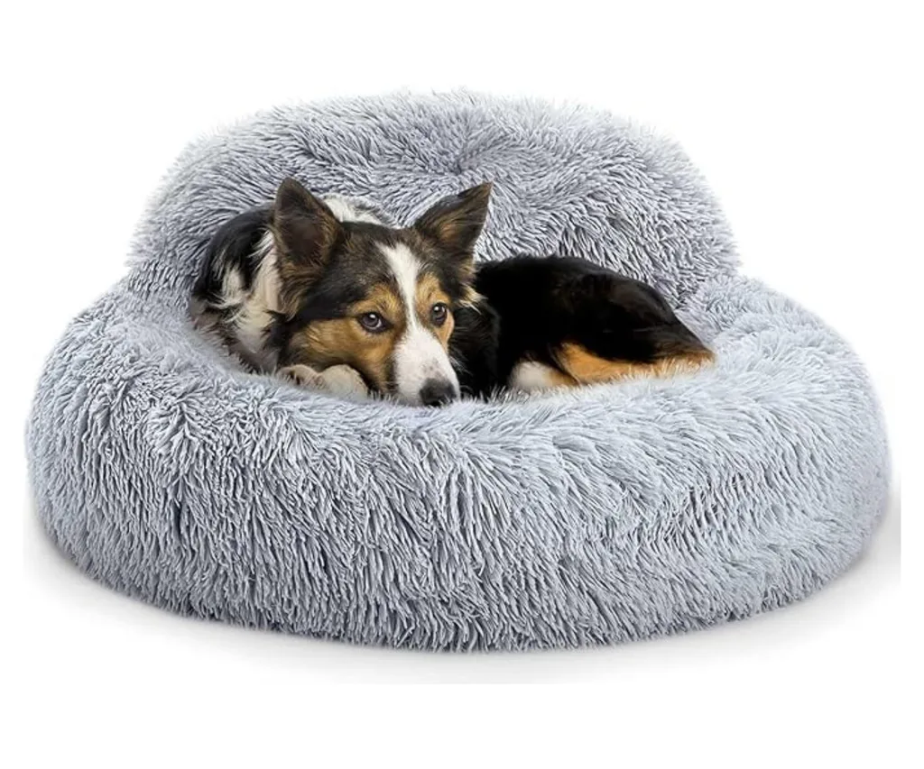 faux fur calming dog bed with back support and dog curled up inside