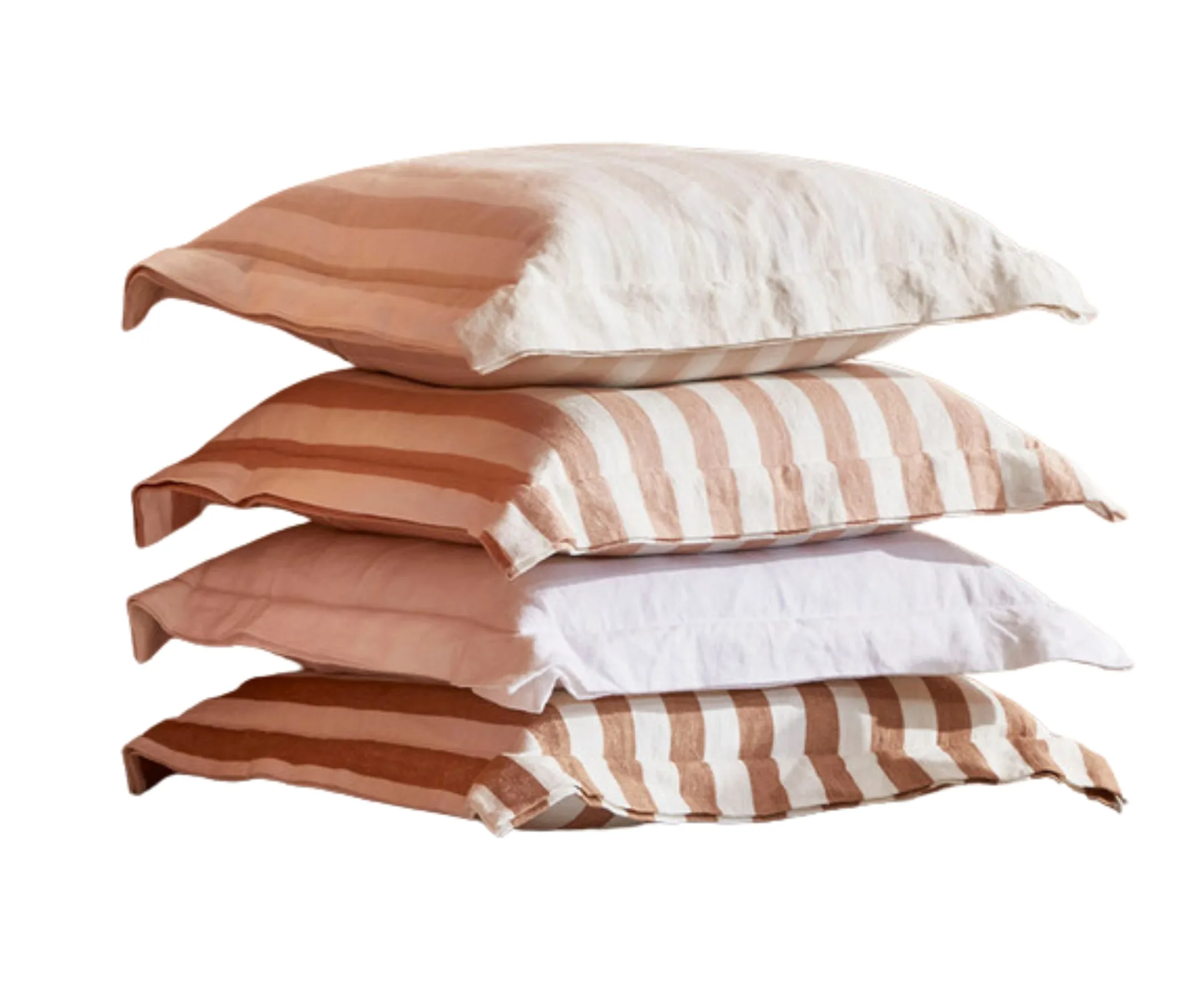 striped cushions stacked on top of each other in browns, whites and warm neutrals