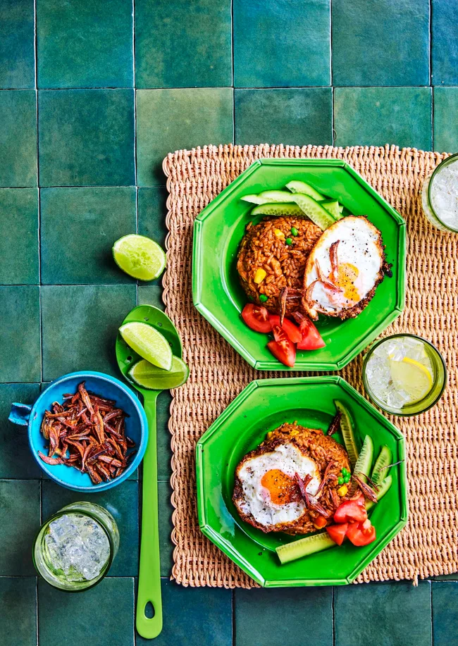 clarissas nasi goreng with fried egg on top on bright green hexagonal plates