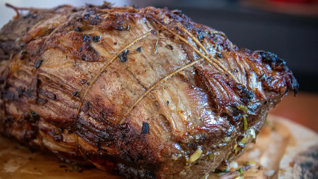 cooked meat sitting on the bench to ret