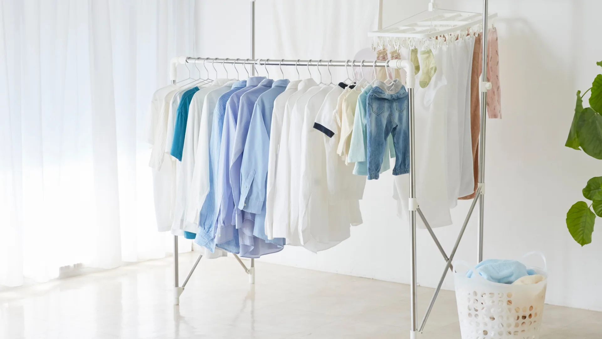 hanging clothes on coathangers to dry
