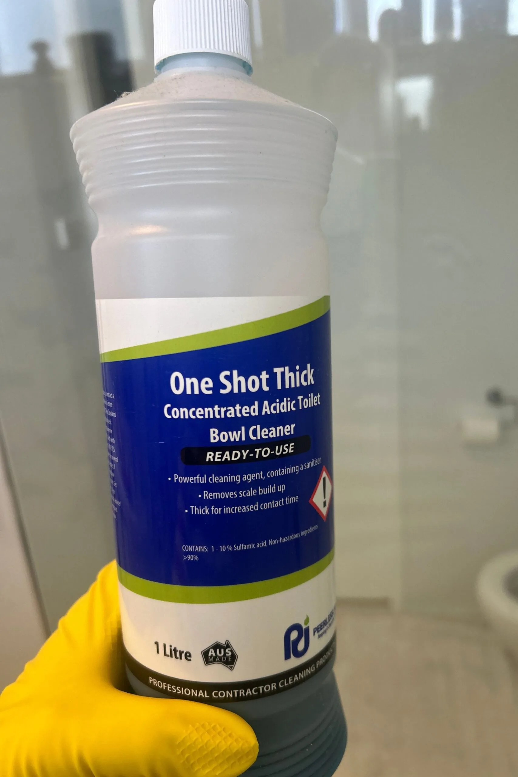 wearing gloves to clean shower with one shot thick
