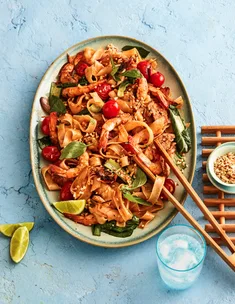 large bowl of noodles with prawn and pork and chopsticks on the side