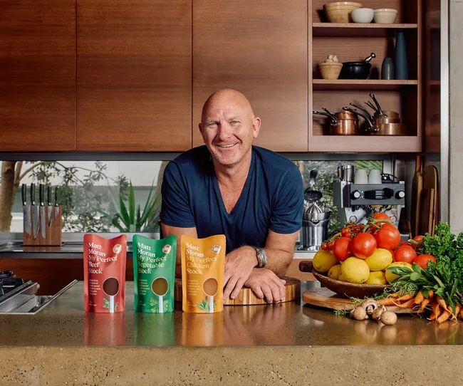 matt moran celebrity chef food brand with stock lined up on counter