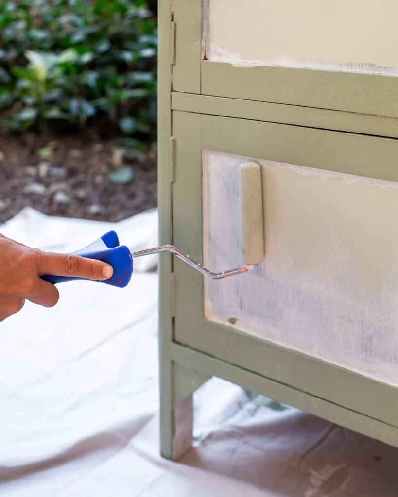 painting top coat onto green cabinet before adding in florals