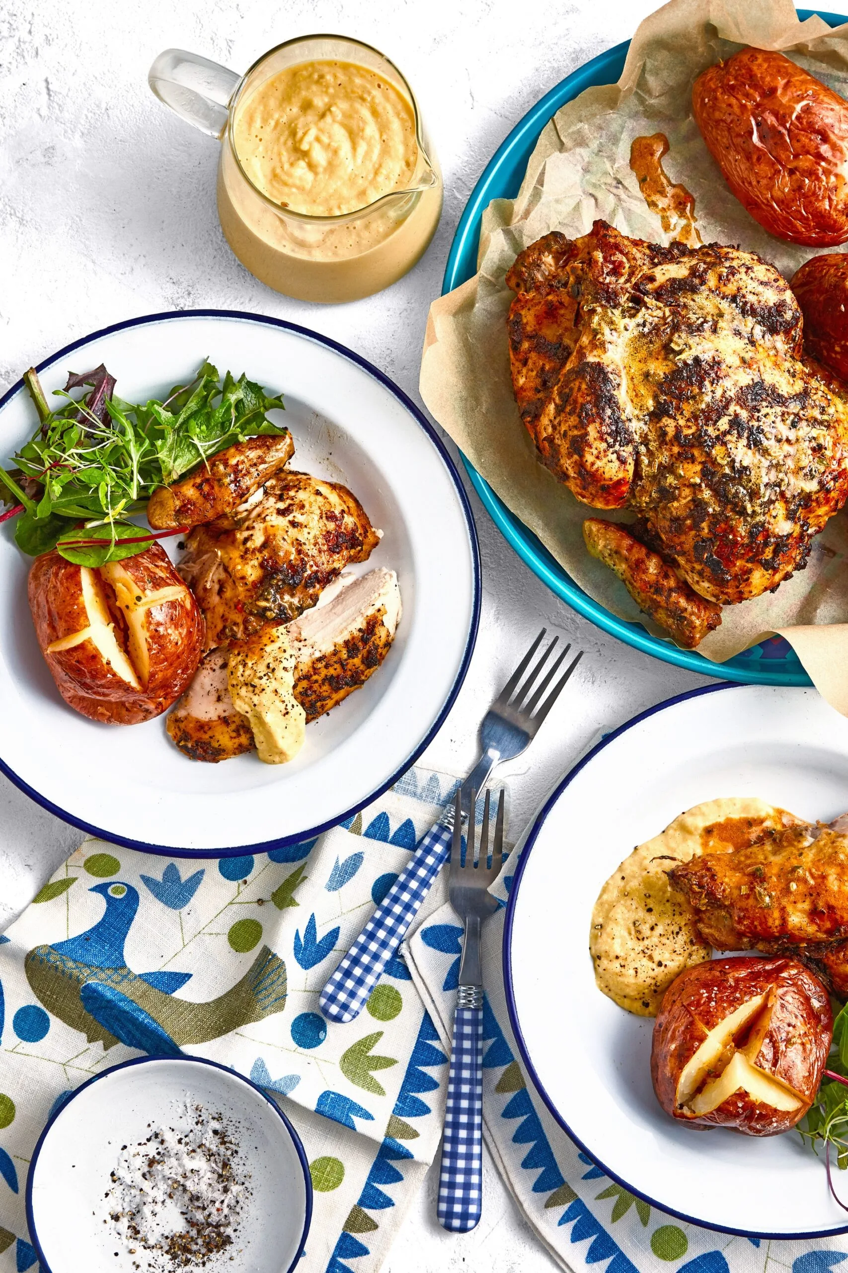 colins campfire chicken in white bowls on a blue and white tablecloth
