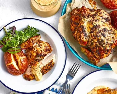 colins campfire chicken in white bowls on a blue and white tablecloth