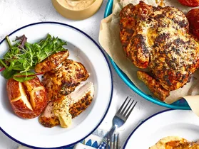 colins campfire chicken in white bowls on a blue and white tablecloth