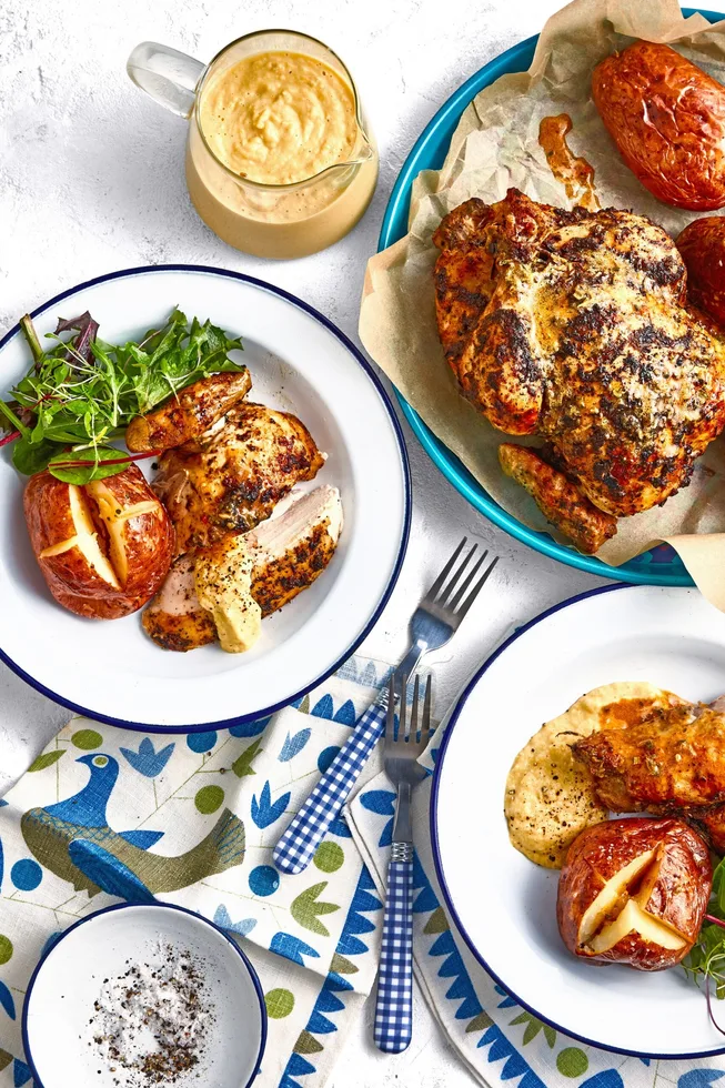 colins campfire chicken in white bowls on a blue and white tablecloth