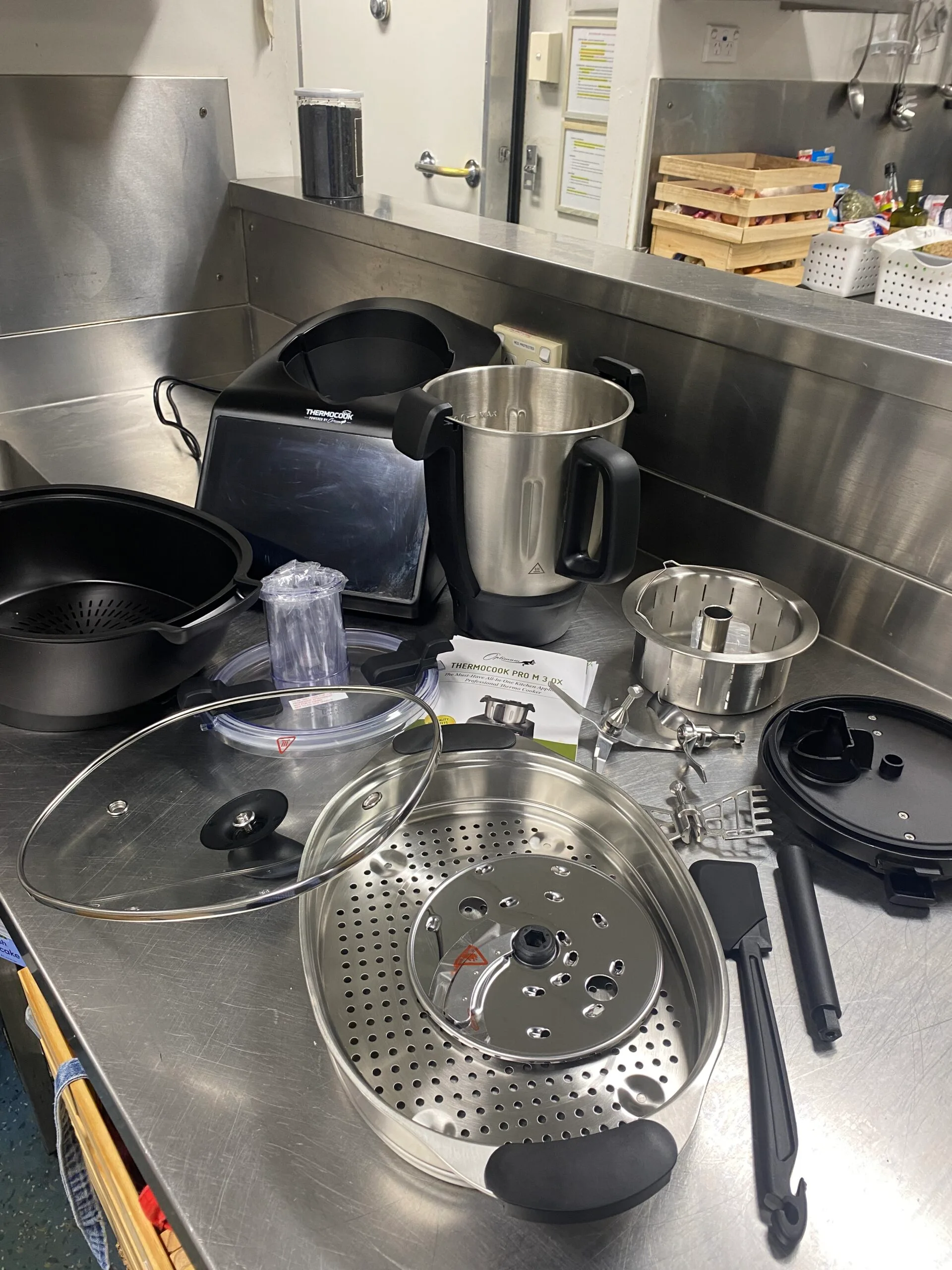 All the inclusions of the optimum thermocook with lids blades and accessories