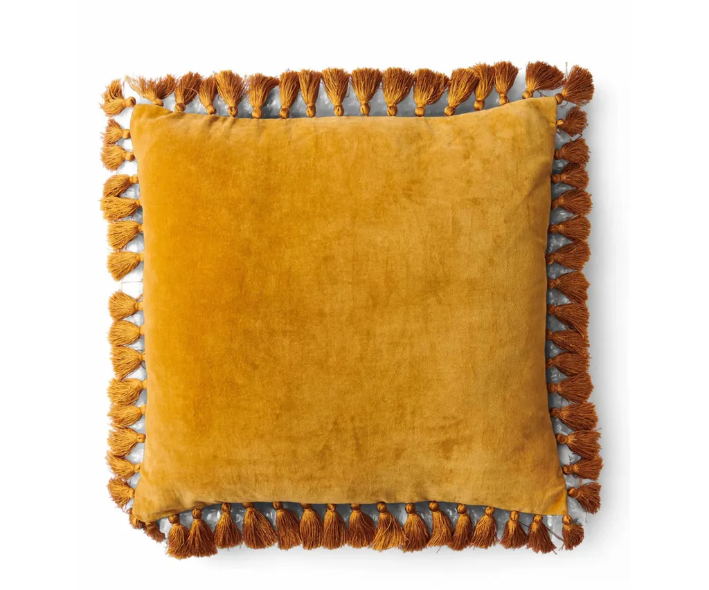orange mustard tasselled velvet pillow in square shape
