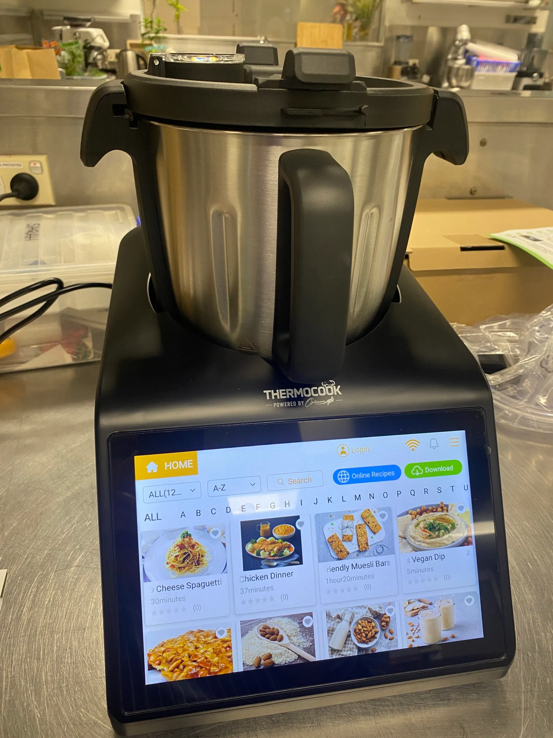 optimum thermocook review with thermocook on and screen displaying different recipes options