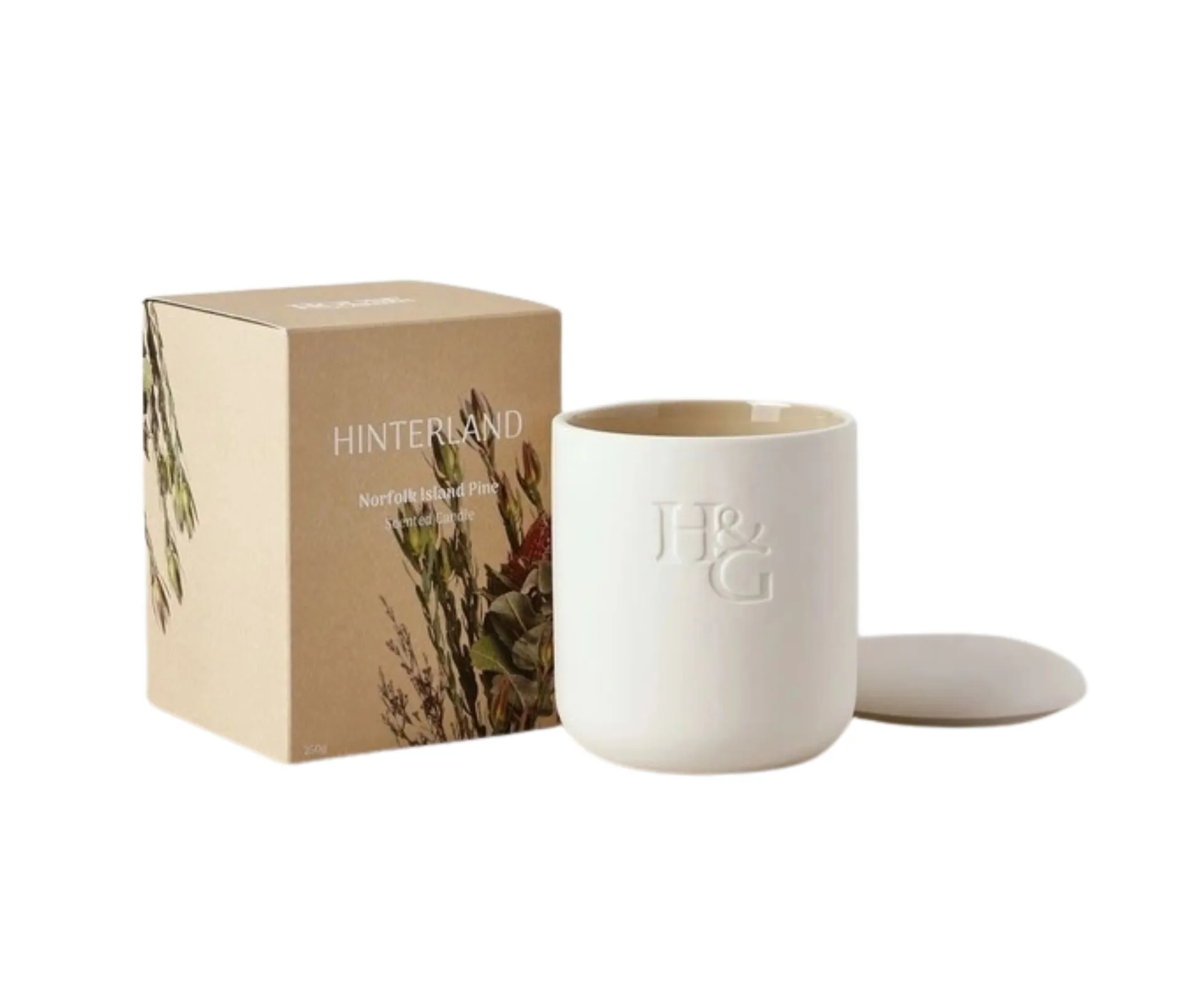 house and garden candle with lid and packaging on the side