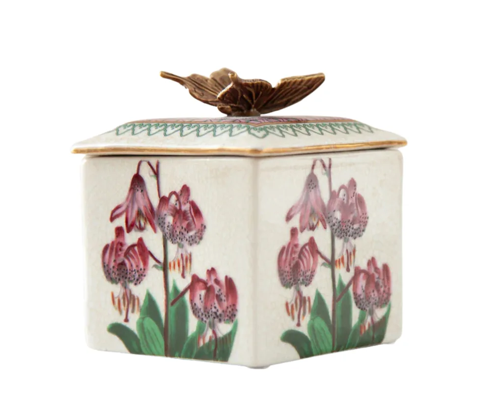 orient design trinket box with metal butterfly on top and painted orchids in pink on the sides