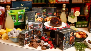 various christmas food products from coles including christmas pudding front and centre and limoncello spritz on the side