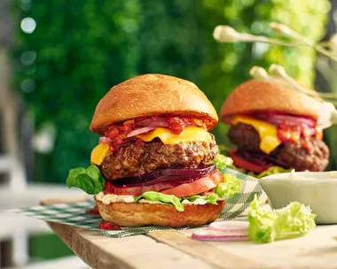 A big beef burger with French onion sauce, cheese, beetroot, onions and salad