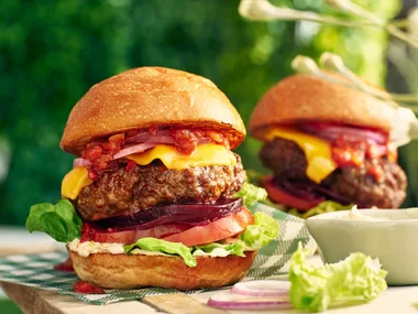 A big beef burger with French onion sauce, cheese, beetroot, onions and salad