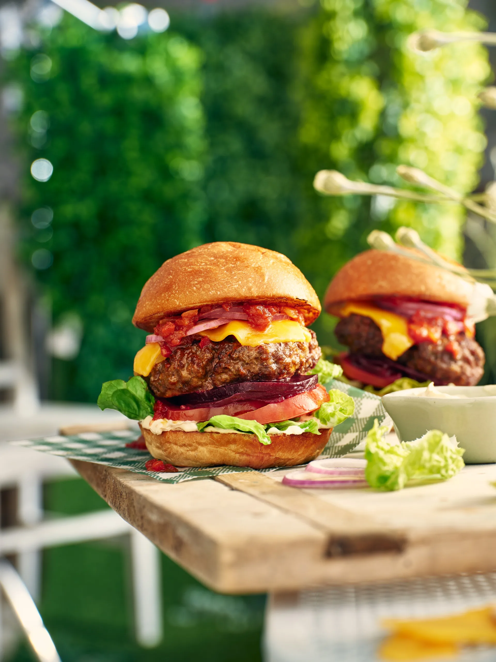 A big beef burger with French onion sauce, cheese, beetroot, onions and salad