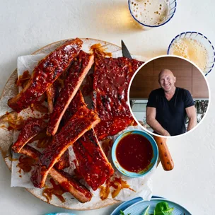 bbq pork ribs made by matt moran on white plate with extra sauce on the side and circle