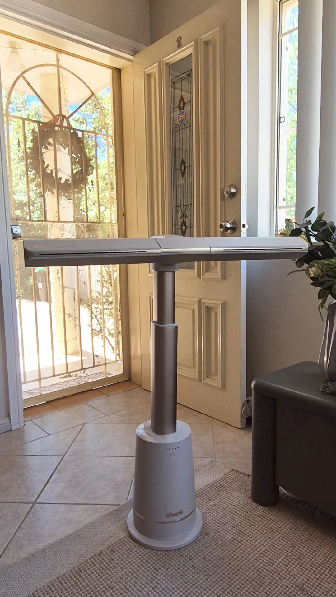 Shark TurboBlade fan set up in a living room and in the horizontal position