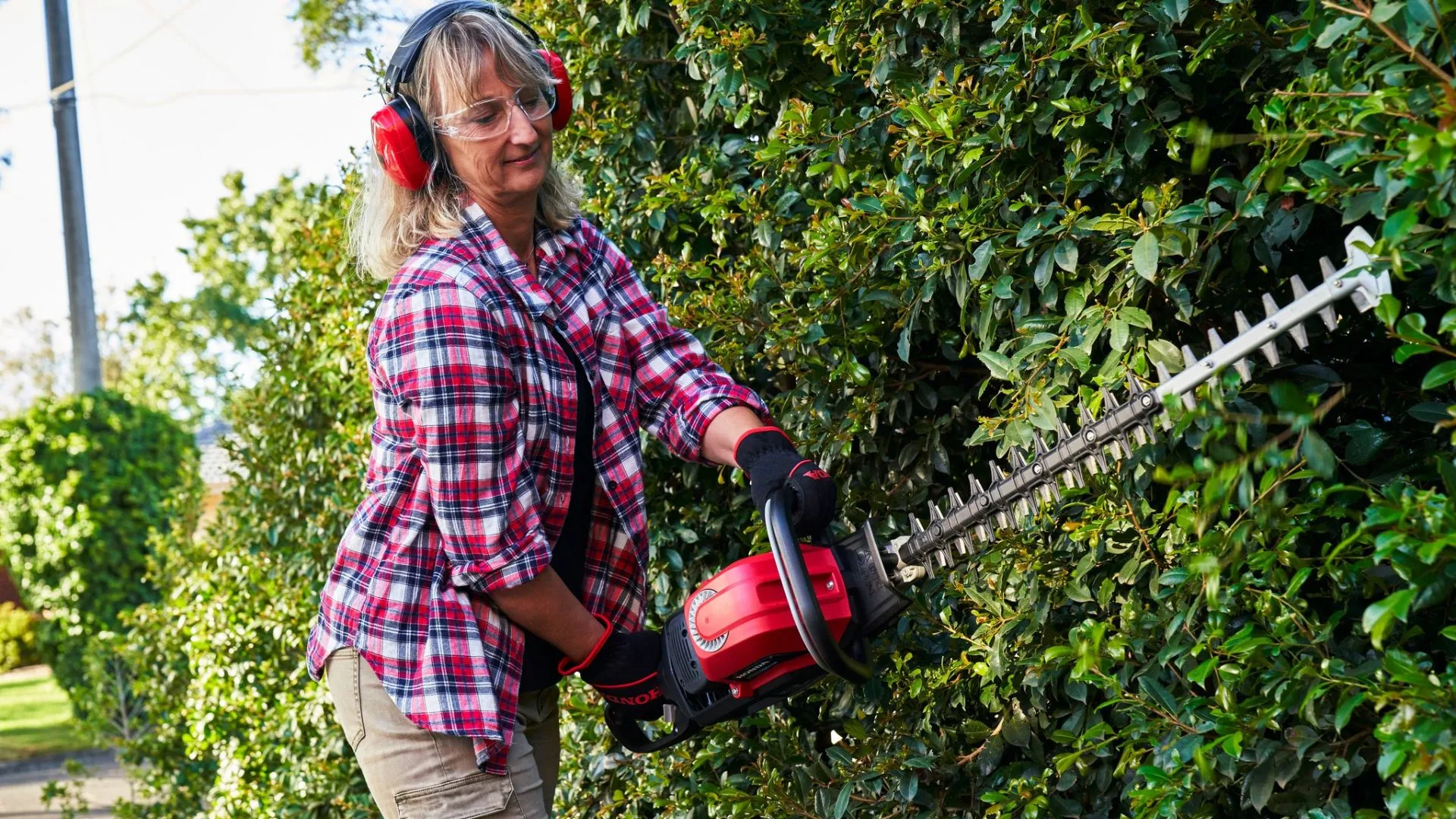 Woman using Honda Hedge trimmer