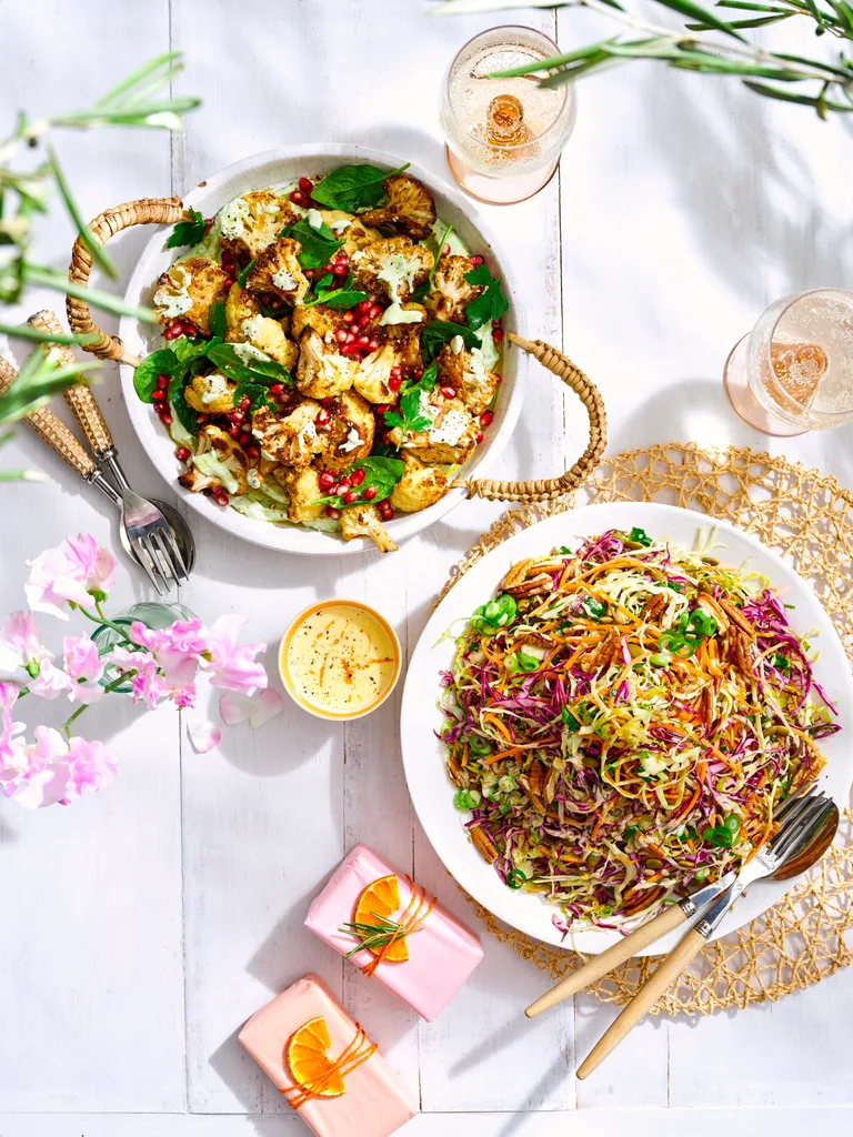 spiced cauliflower with tahini sauce and sprouts and seeds slaw