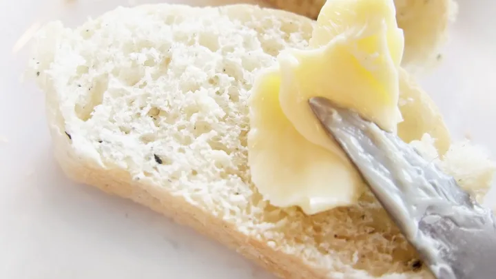 buttering bread with a knife