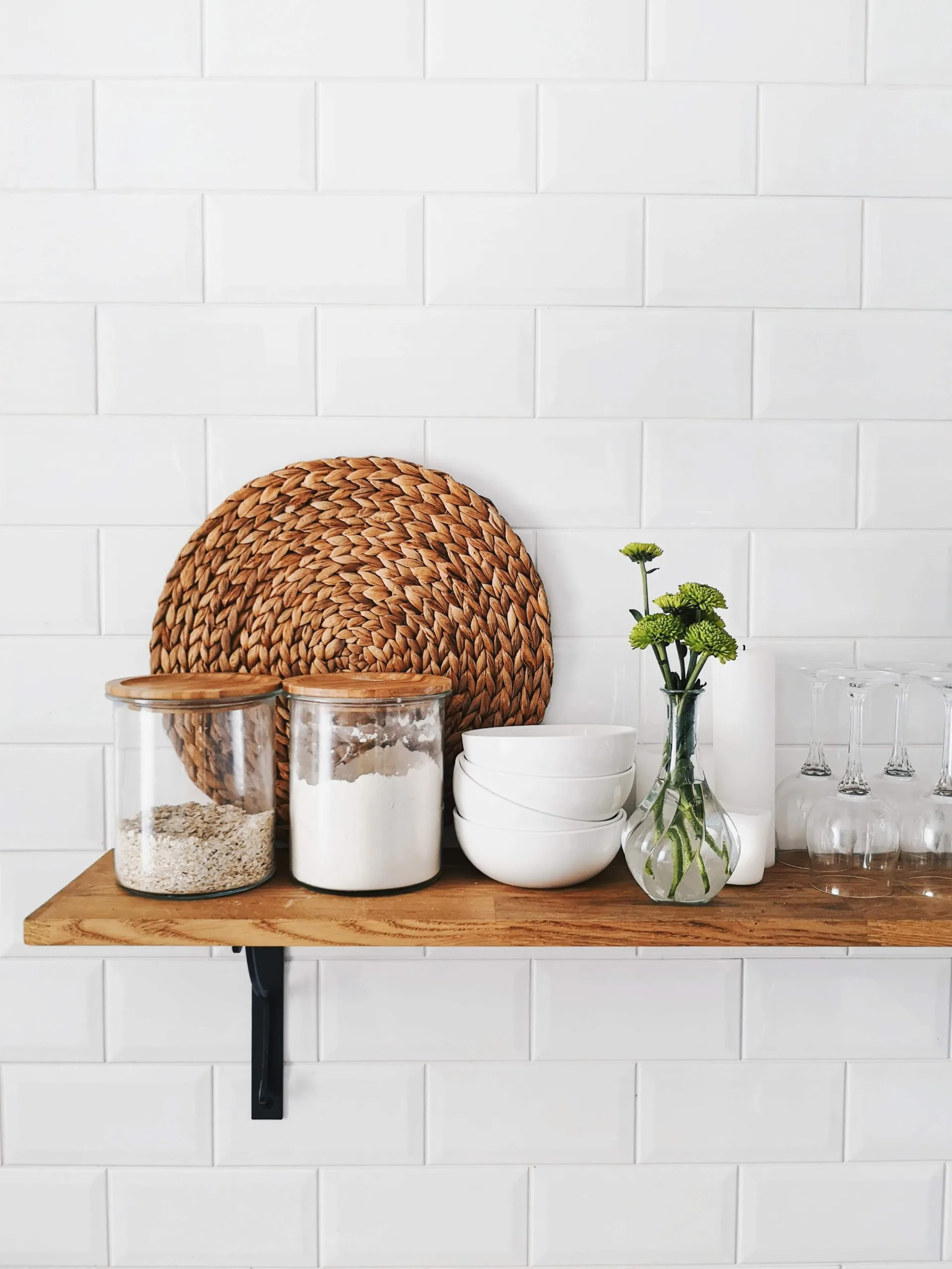 shelf with glassware, sugar in containers and placemat 