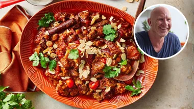 Lamb tagine recipe served on a bright orange plate. Chef Matt Moran's headshot is inset.