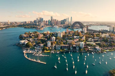 aerial shot of sydney harbour with harbour bridge and opera house in view