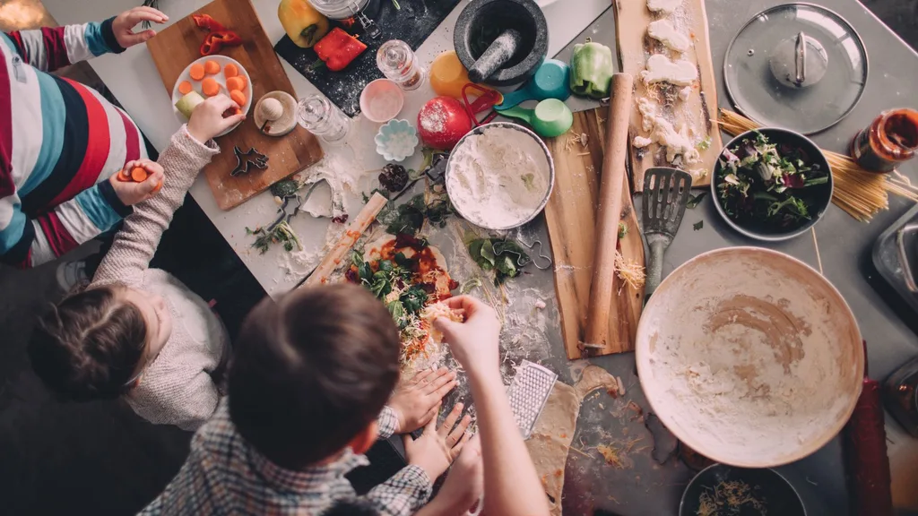 Messy kitchen bench with food prepping