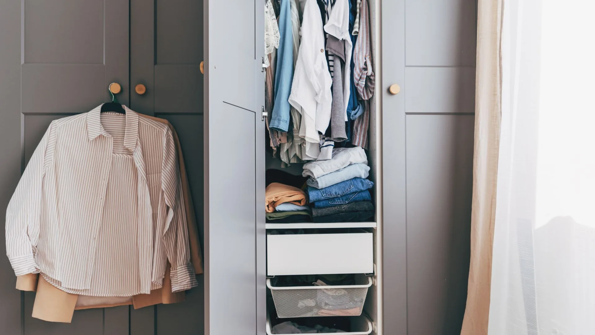 Wardrobe open with outfit hanging